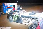 Sport Mod car number 18 of John Ingelhart sits on the track after hitting the wall and rolling at Oklahoma Sports Park.